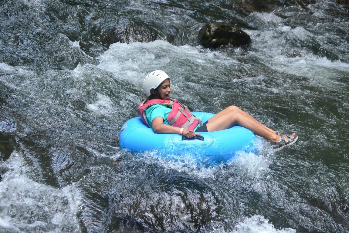 Woman river tubing