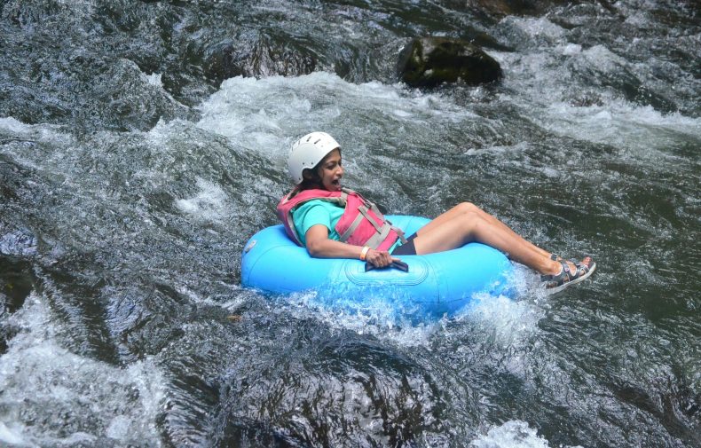 Woman river tubing