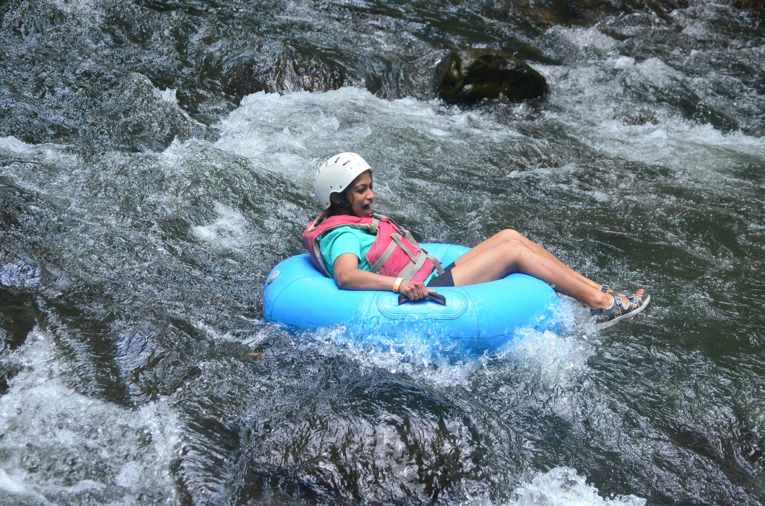 Woman river tubing